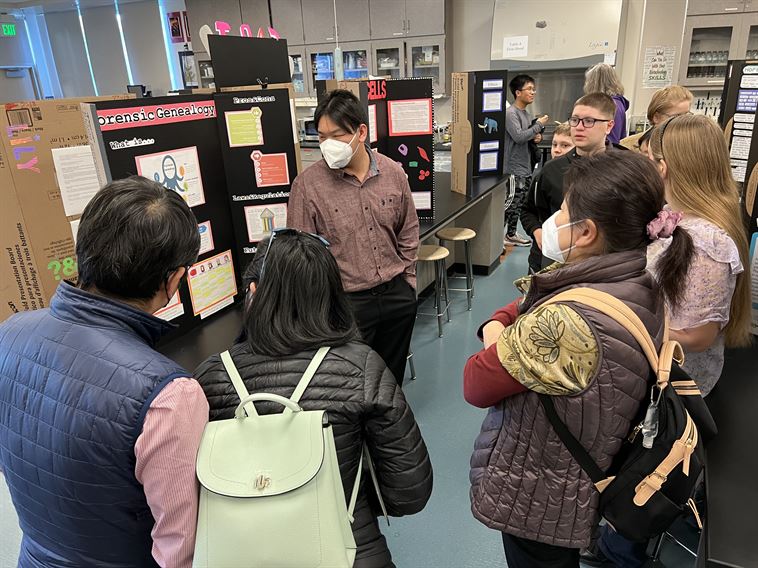 Student presenting a project at Open House